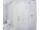 Modern bathroom features a glass-enclosed shower with white marbled tile and sleek hardware at 255 Northland Ridge Trl, Atlanta, GA 30342