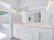 Bright bathroom with double sink, white cabinets and marble countertop at 255 Northland Ridge Trl, Atlanta, GA 30342
