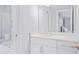 Contemporary bathroom with white cabinets, marble countertop, and a bathtub with a glass door at 255 Northland Ridge Trl, Atlanta, GA 30342