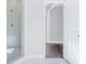 Modern bathroom featuring a glass-enclosed shower and a view of the Primary suite at 255 Northland Ridge Trl, Atlanta, GA 30342