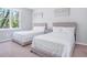 Inviting bedroom with two beds, soft carpet, and lots of natural light at 255 Northland Ridge Trl, Atlanta, GA 30342
