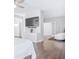 Spacious bedroom with hardwood floors, a TV, and a view of the backyard at 255 Northland Ridge Trl, Atlanta, GA 30342