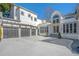Modern home with a three-car garage and beautiful architectural details at 255 Northland Ridge Trl, Atlanta, GA 30342