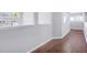 Hallway boasts hardwood floors and neutral paint, connecting various rooms at 255 Northland Ridge Trl, Atlanta, GA 30342