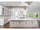 Bright, modern kitchen with an island, stainless steel appliances, and marble countertops at 255 Northland Ridge Trl, Atlanta, GA 30342
