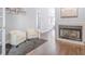 Cozy living room with a fireplace and two white chairs on a gray rug at 255 Northland Ridge Trl, Atlanta, GA 30342