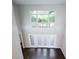 Living room with large windows and hardwood floors at 255 Northland Ridge Trl, Atlanta, GA 30342