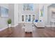 Bright living room featuring white sofas at 255 Northland Ridge Trl, Atlanta, GA 30342