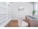 Home office with custom built in bookshelves and a desk with chairs at 255 Northland Ridge Trl, Atlanta, GA 30342