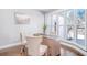 Home office with a large window, hardwood floors, and a desk with chairs at 255 Northland Ridge Trl, Atlanta, GA 30342