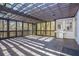 Spacious screened patio with wooden deck, pergola and grill area at 255 Northland Ridge Trl, Atlanta, GA 30342