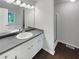 Bathroom featuring double sinks, a garden tub, and a glass-enclosed shower at 3766 Windy Hill Se Dr, Conyers, GA 30013