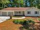 Inviting single-story home with a cozy front porch and a well-maintained yard at 3766 Windy Hill Se Dr, Conyers, GA 30013