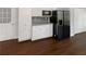 Bright kitchen featuring white cabinets, stainless steel refrigerator, and modern appliances at 3766 Windy Hill Se Dr, Conyers, GA 30013