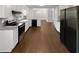 Modern kitchen with sleek appliances, white cabinets, and open layout for dining at 3766 Windy Hill Se Dr, Conyers, GA 30013