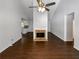 Spacious living room featuring a brick fireplace, vaulted ceilings, and sleek hardwood floors at 3766 Windy Hill Se Dr, Conyers, GA 30013