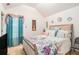 Cozy bedroom with floral bedding and bright curtains at 6664 Saint Jude Dr, Fairburn, GA 30213