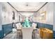 Elegant dining room with wainscoting, chandelier, and large mirror at 6664 Saint Jude Dr, Fairburn, GA 30213