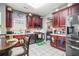 Functional kitchen with dark wood cabinets and stainless steel appliances at 6664 Saint Jude Dr, Fairburn, GA 30213