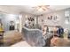 Cozy living room with a ceiling fan and comfortable seating, perfect for relaxing at 6664 Saint Jude Dr, Fairburn, GA 30213