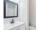 Bathroom with a sleek vanity, modern mirror, and clean white finishes at 100 Davis Mill N Rd, Dallas, GA 30157