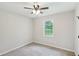 Comfortable bedroom featuring plush carpeting and large window with backyard view at 100 Davis Mill N Rd, Dallas, GA 30157