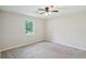 Neutral bedroom with lush carpeting, a ceiling fan, and a tranquil backyard view at 100 Davis Mill N Rd, Dallas, GA 30157