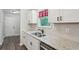 Bright kitchen features granite counters, stainless sink, tile backsplash, and ample cabinet space at 100 Davis Mill N Rd, Dallas, GA 30157