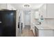 Updated kitchen boasts new stainless steel appliances, white cabinetry, and sleek countertops at 100 Davis Mill N Rd, Dallas, GA 30157