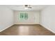 Bright living room with hardwood floors, a window, and a white front door at 100 Davis Mill N Rd, Dallas, GA 30157