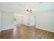 Spacious open living room with hardwood floors and white walls is awaiting your design touch at 100 Davis Mill N Rd, Dallas, GA 30157