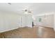 A spacious living room with hardwood floors leads into the kitchen with stainless steel appliances at 100 Davis Mill N Rd, Dallas, GA 30157