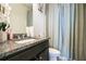 Bathroom featuring granite countertop vanity, toilet, and shower with curtain at 2496 Osceola Rd, Lithonia, GA 30058