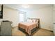 Cozy bedroom featuring a comfortable bed with soft bedding, a TV, and natural light at 2496 Osceola Rd, Lithonia, GA 30058