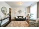 Inviting living room featuring a plush rug, neutral decor, and stylish lighting fixtures at 2496 Osceola Rd, Lithonia, GA 30058