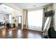 Bright living room with hardwood floors, large window, and neutral paint colors at 2496 Osceola Rd, Lithonia, GA 30058