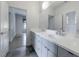 Bathroom featuring dual sinks, large vanity, and modern finishes at 3117 W Roxboro Ne Rd, Atlanta, GA 30324