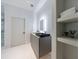 Modern bathroom with walk-in shower, floating vanity and storage shelves at 3117 W Roxboro Ne Rd, Atlanta, GA 30324