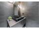 Chic powder room featuring a modern black sink, and slate style tile at 3117 W Roxboro Ne Rd, Atlanta, GA 30324