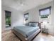 Bright bedroom with a light blue color scheme with windows that overlook the backyard at 3117 W Roxboro Ne Rd, Atlanta, GA 30324