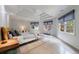 Primary bedroom with tray ceiling, multiple windows, and neutral decor at 3117 W Roxboro Ne Rd, Atlanta, GA 30324