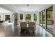 Dining room with bay windows and sliding glass doors leading to the outdoor area at 3117 W Roxboro Ne Rd, Atlanta, GA 30324