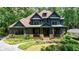 Charming two-story home with manicured front yard and inviting front porch at 3117 W Roxboro Ne Rd, Atlanta, GA 30324