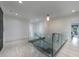 Bright hallway with glass railing overlooking the floor below at 3117 W Roxboro Ne Rd, Atlanta, GA 30324