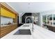 Kitchen island with marble countertops, double sinks, and views of the living area at 3117 W Roxboro Ne Rd, Atlanta, GA 30324