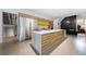 Modern kitchen with stainless steel appliances, large island, and custom wood cabinetry at 3117 W Roxboro Ne Rd, Atlanta, GA 30324