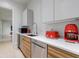 Bright kitchen featuring modern stainless steel appliances and sleek wood grain cabinets at 3117 W Roxboro Ne Rd, Atlanta, GA 30324