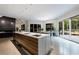 Spacious kitchen with a large island, waterfall countertop, and ample counter space at 3117 W Roxboro Ne Rd, Atlanta, GA 30324