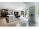 Spacious open-concept kitchen featuring an island, wine storage, and a view of the outdoor patio at 3117 W Roxboro Ne Rd, Atlanta, GA 30324