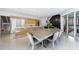 Open kitchen and dining area featuring modern design, wood cabinets, and stainless steel appliances at 3117 W Roxboro Ne Rd, Atlanta, GA 30324